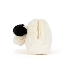 A white faux fur cosmetic pouch shaped like a dog's head, featuring black ears, nose, and eyes, on a solid white background. Side view. 